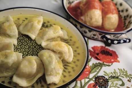 polish dough on white plate with butter sauce
