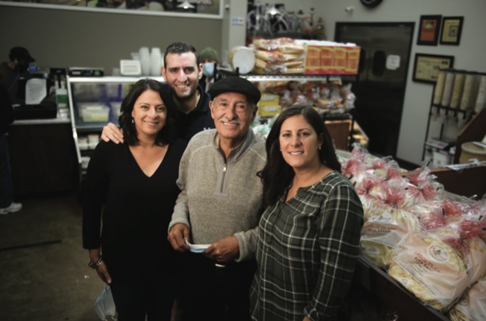 S&D grocer owners standing together