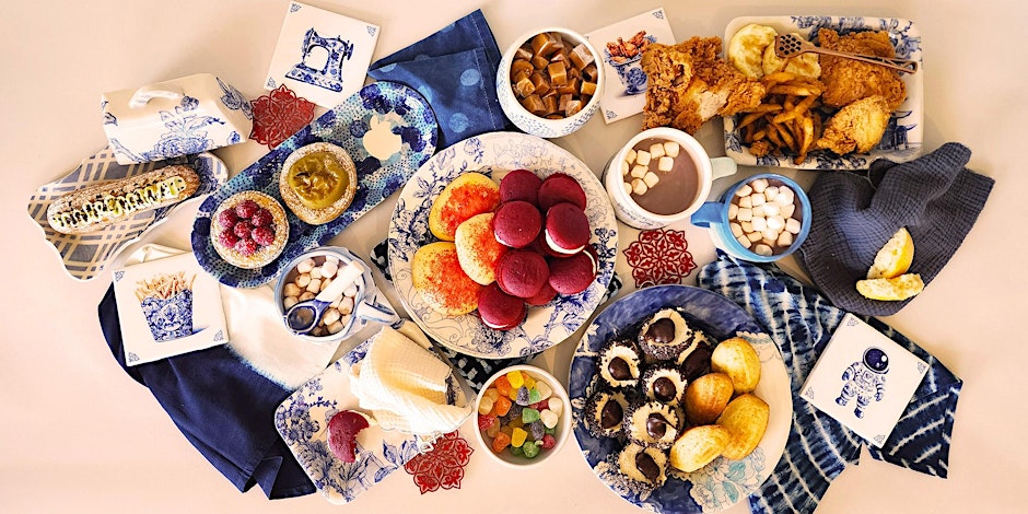 A display of blue and white dishes on a tan background.