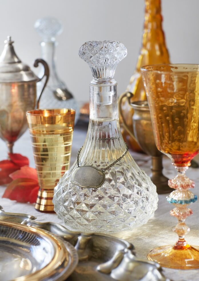 Various colored glassware on a table.