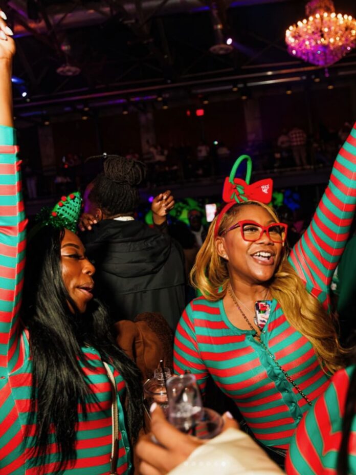 Ditch Day Thanksgiving Edition Two women dance at a party in Pittsburgh in Christmas pajamas.