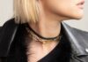 Shop Fall Jewelry Trends in Pittsburgh with Stylist Dominika Bronner A woman wears a black shirt and jacket with a gold chain necklace.