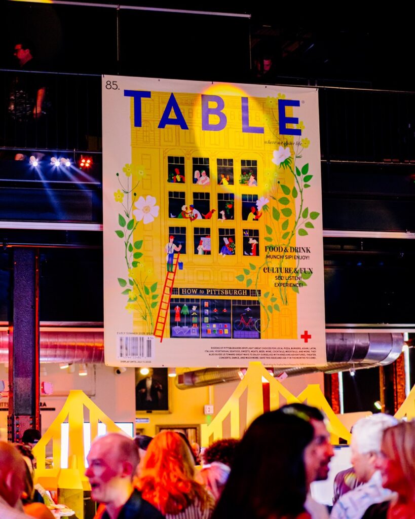 A poster of a yellow building with a TABLE header over it.