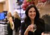 Journey of the Senses at Larrimor’s A woman in a black long sleeve holds a wine glass, smiling.