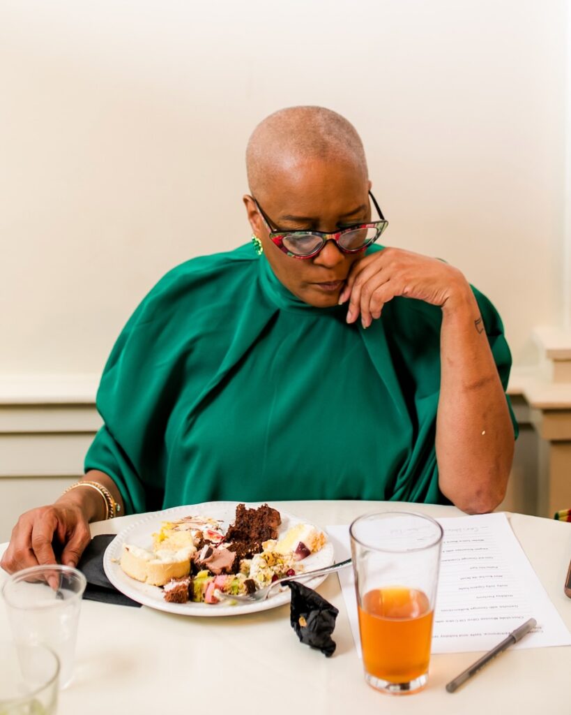 Judge Chef Jackie Page scoring and tasting