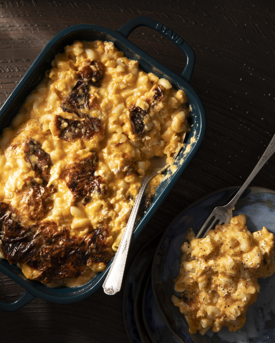 A delicious casserole dish of macaroni and cheese, made with a variety of cheeses and perfectly cooked elbow macaroni.