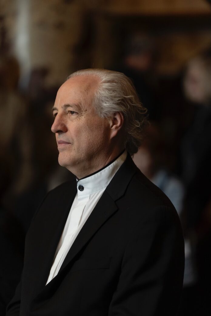 Pittsburgh Symphony Orchestra's Best Moments TABLE Magazine A man in a black suit jacket and white shirt stands in a profile view.