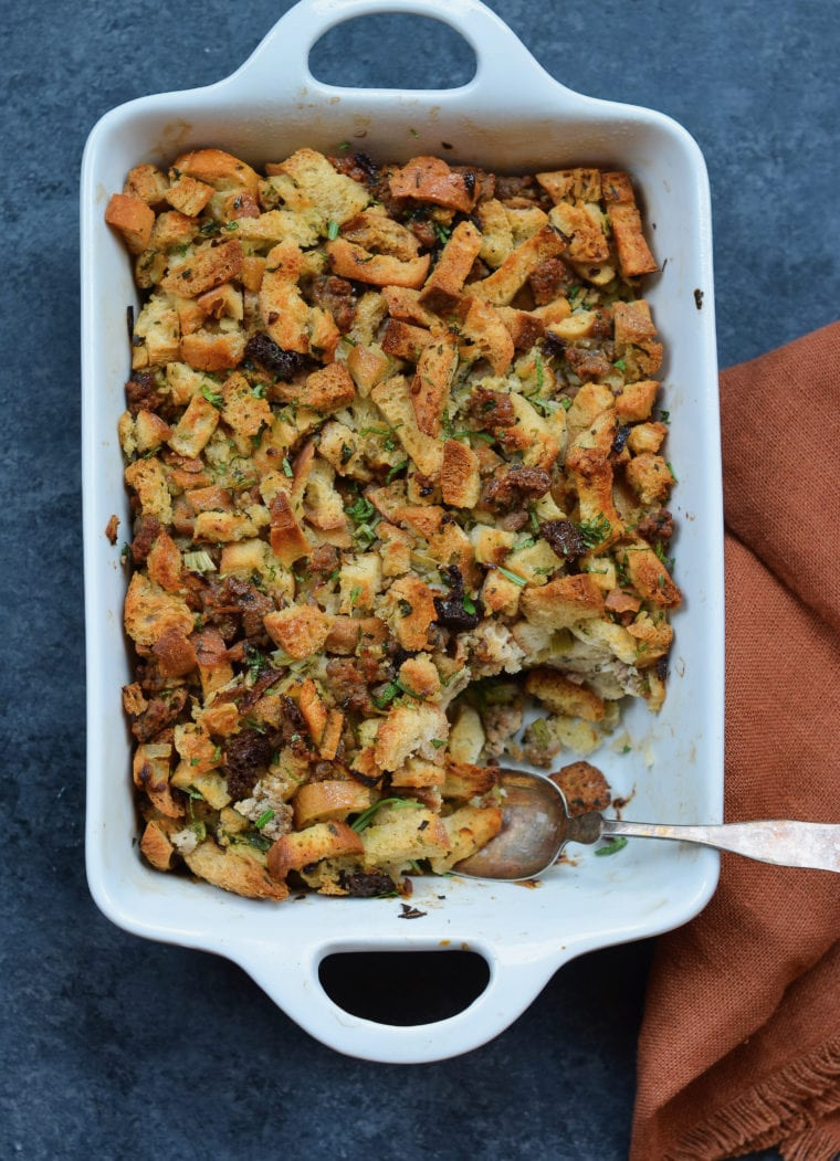 A sausage stuffing in a white tray on a blue background