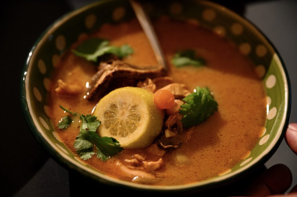 A tomato looking soup with lemon and basil.