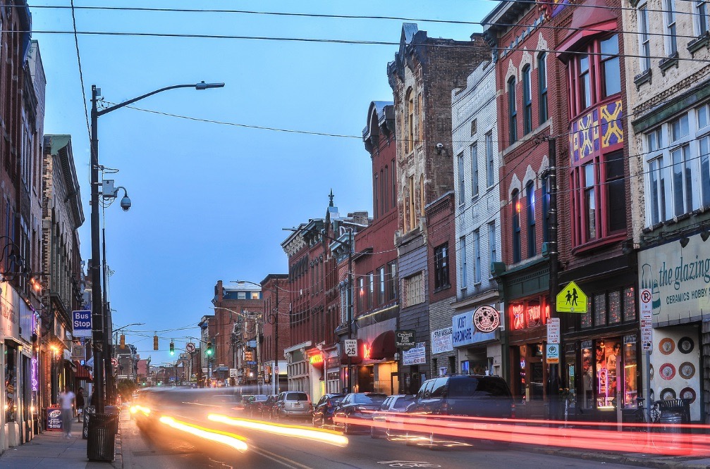 East Carson street in Pittsburgh with cars zooming down it.
