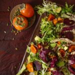 Colorful salad with tomatoes on side