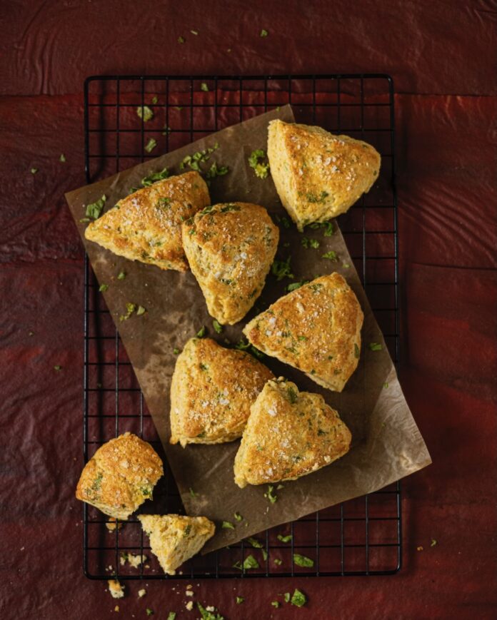 Savory Kale, Cheese, and Cornmeal Scones Savory Kale, Cheese, and Cornmeal Scones on a baking sheet.