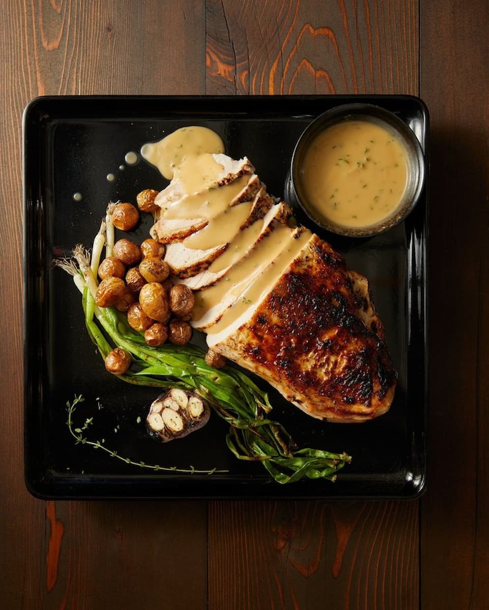 A perfectly cooked and tender turkey breast sous vide, ensuring optimal juiciness and flavor, resulting in a succulent centerpiece for your holiday feast