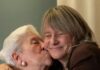 Giving Guide 2025: Vincentian An older woman kisses another on their cheek.