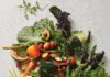 What Food Can Help Your Skin Glow? A variety of colorful and fresh produce, including papaya, strawberries, avocados, tomatoes, broccoli, peppers, cauliflower, and leafy greens, promoting skin health.