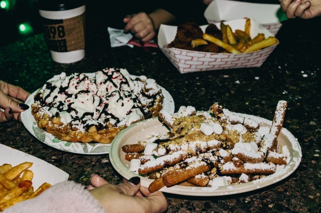 Funnel cake fries and a regular funnel cake.