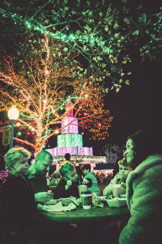 A family eats at a table at Kennywood.