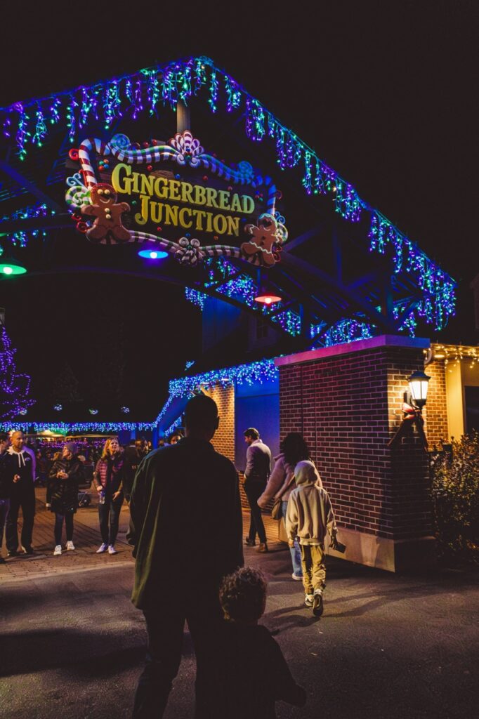 A family walking into Gingerbread Junction.