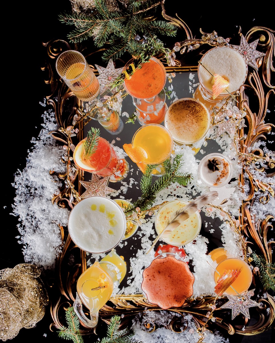Twelve cocktails for the twelve days of Christmas, staged with cheery decor