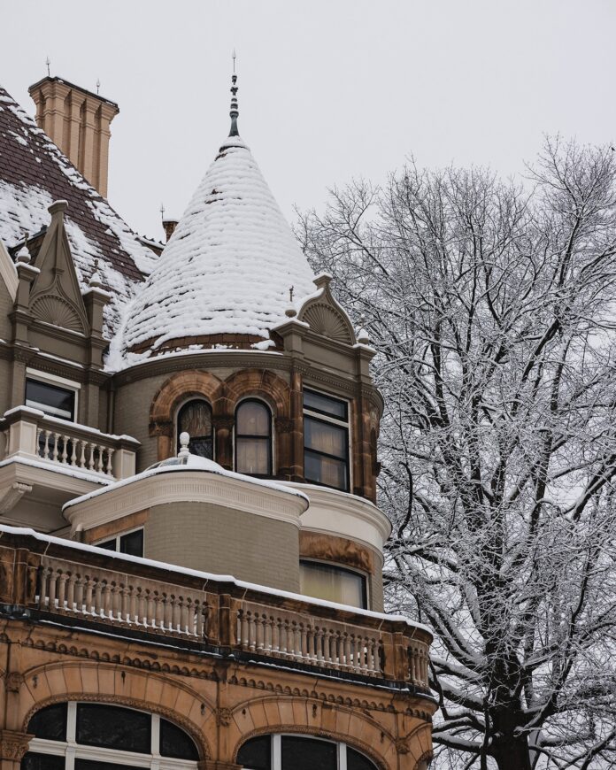 Winterfest at The Frick The outside of The Frick Pittsburgh tower covered in snow.