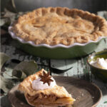 Homemade apple pie with flaky lard crust, cinnamon-scented apples, and golden-brown top crust.