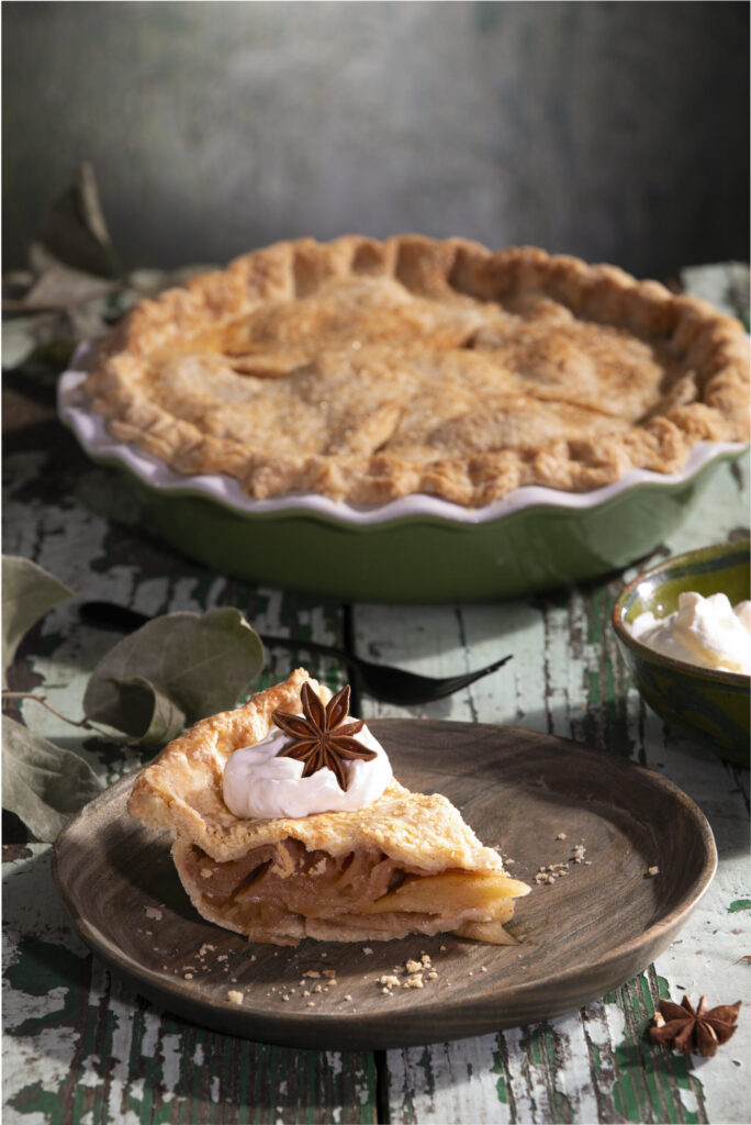 Homemade apple pie with flaky lard crust, cinnamon-scented apples, and golden-brown top crust.