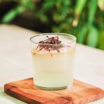 Coco and Mango Milk Punch greenery in the background