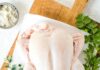 The Food Trends Defining 2026: Comfort Cooking, New Proteins, GLP-1 Diets, and Smarter Grocery Spending An uncooked chicken sits on a cutting board.