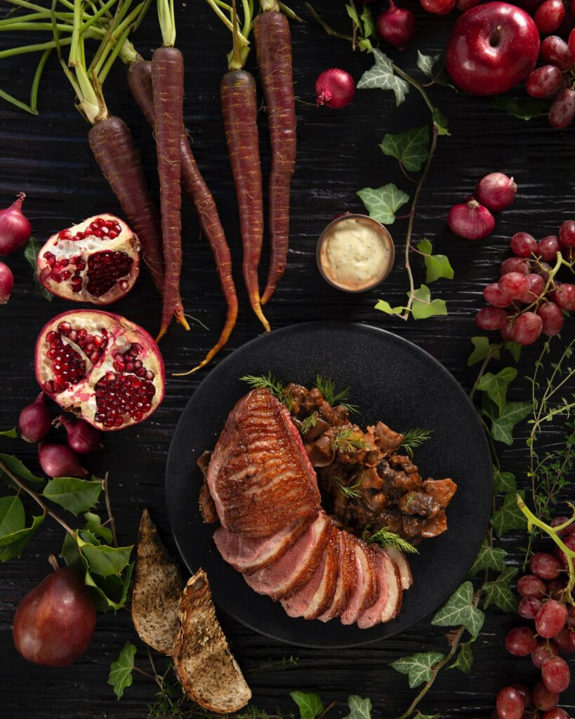 An aerial shot of Mushroom Ragout Over Garlic Crostini With Spiced Duck
