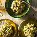 Three plates full of High Protein Chicken Salad with nuts on top.