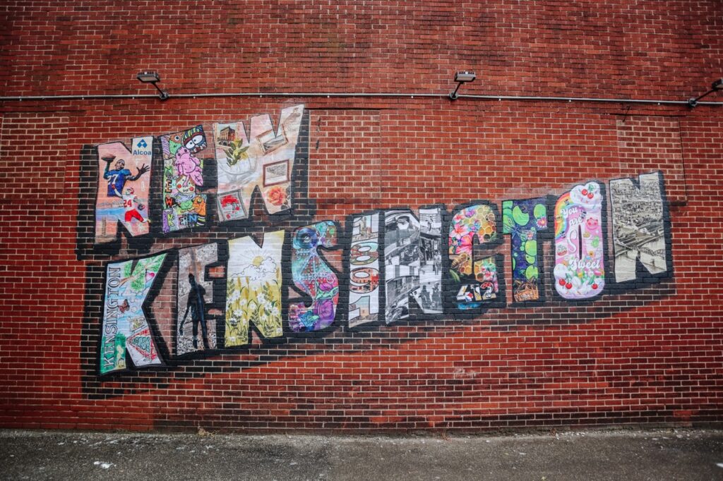 An outside wall is painted with New Kensington.