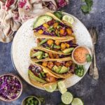 Squash Tacos sitting on a white plate
