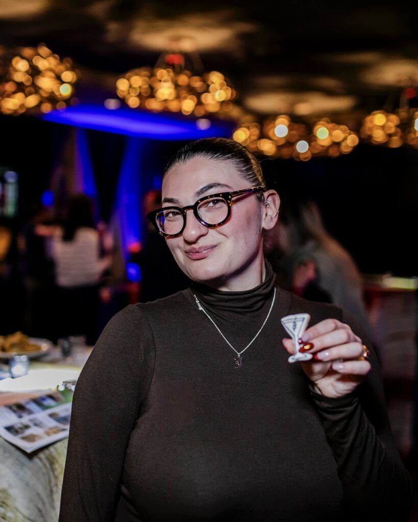 Hungry Jess holds a martini glass sugar cookie.