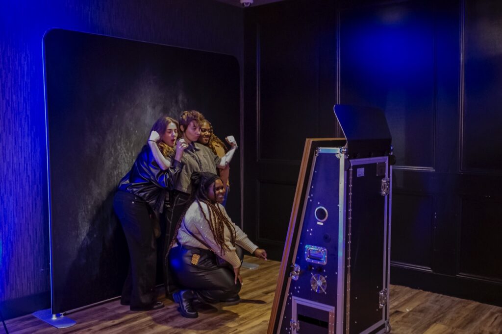 A group of ladies pose for the photobooth.