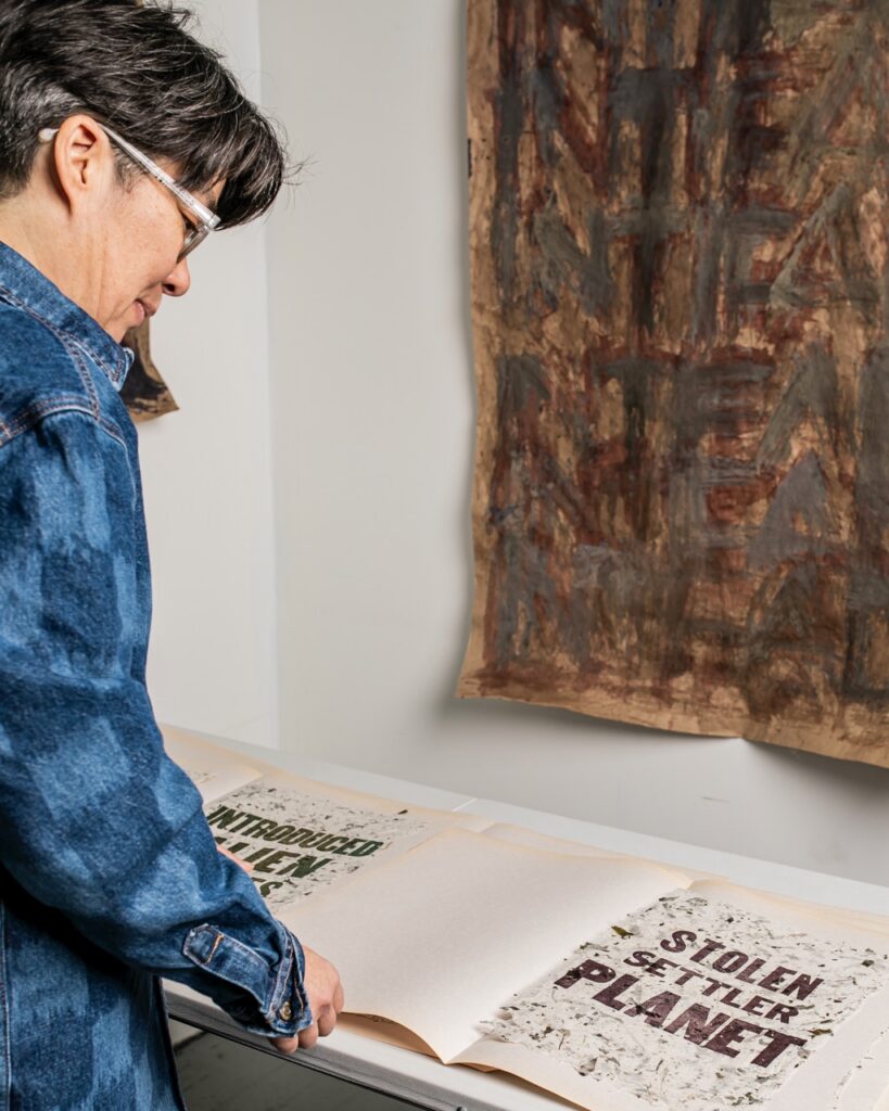 Ginger Brooks Takahashi looks over her work.