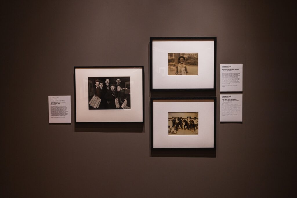 A gallery wall with three photos framed on it.