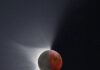 Your March 2026 Horoscope for the Full Moon in Virgo and Lunar Eclipse A lunar eclipse moves over a full moon in the night sky, shining light out to the left side.