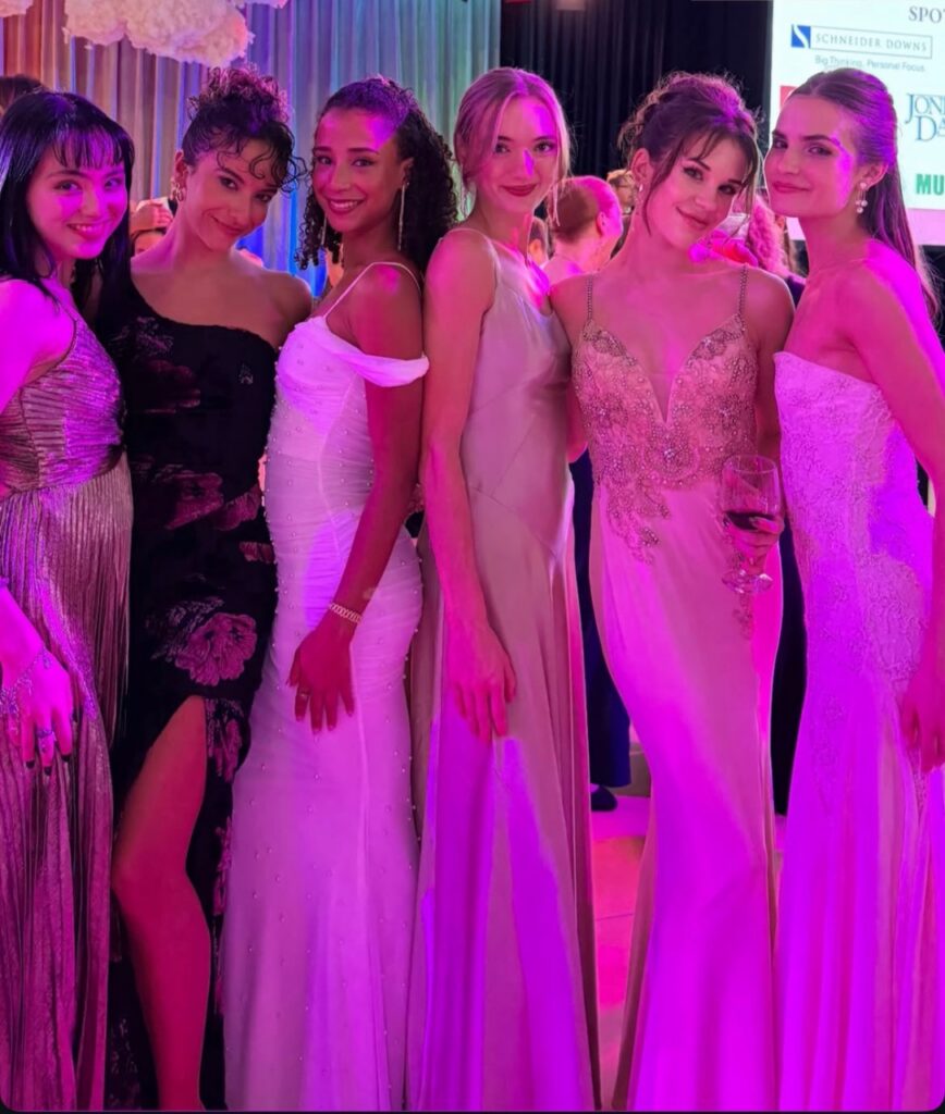 A group of girls in slim dresses.