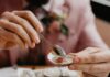 Caterers Around Pittsburgh for Any Group Big or Small A man puts a red sauce onto a pail full of oysters at a table.
