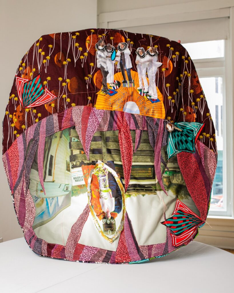 A large multimedia art piece with colors and abstract shapes.