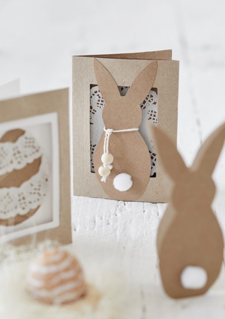 Brown paper cards with silhouettes of bunnies on them.