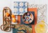 Floral Designs for Spring Ideas to Brighten Your Home A coastal-inspired design by Jennifer Janeway Designs featuring coral Thibaut Paper Rattan wall covering, Phillip Jeffries Fable wallpaper in Sepia Garden, and sky blue accents.