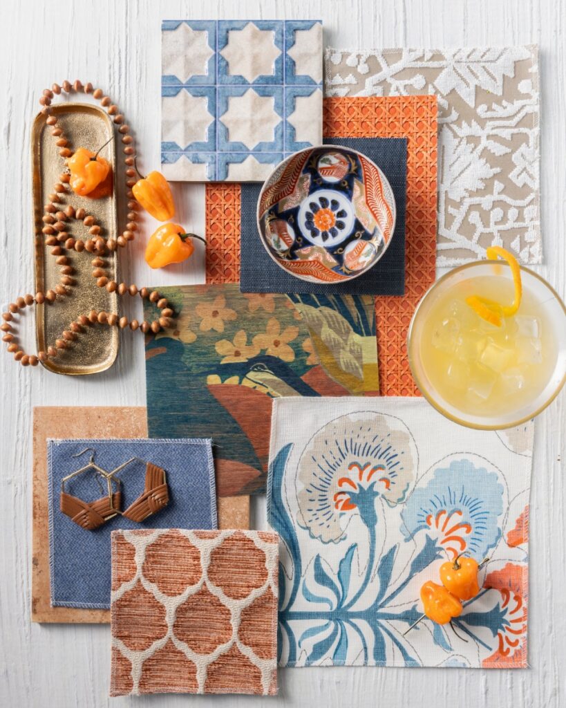 A coastal-inspired design by Jennifer Janeway Designs featuring coral Thibaut Paper Rattan wall covering, Phillip Jeffries Fable wallpaper in Sepia Garden, and sky blue accents.