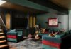 How to Renovate Overlooked Spaces Into Stylish, Valuable Rooms A luxurious basement lounge designed by Seashal Belldina featuring deep green color-washed walls, a gold ceiling, jewel-tone velvet seating, and a modern bar.