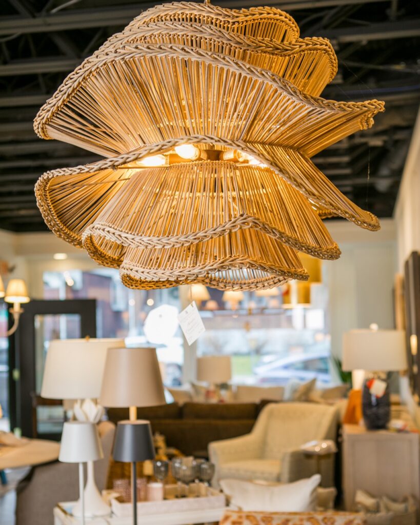 A wood light shade hanging from a ceiling.