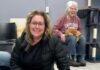 Pittsburgh Events: Your Guide to March 30-April 5 A woman sits on the floor behind a white and black cat.