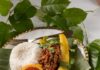 Puerto Rican Canoas (Stuffed Plantains) Plantains full of a meat filling beside a grapefruit slice and rice.