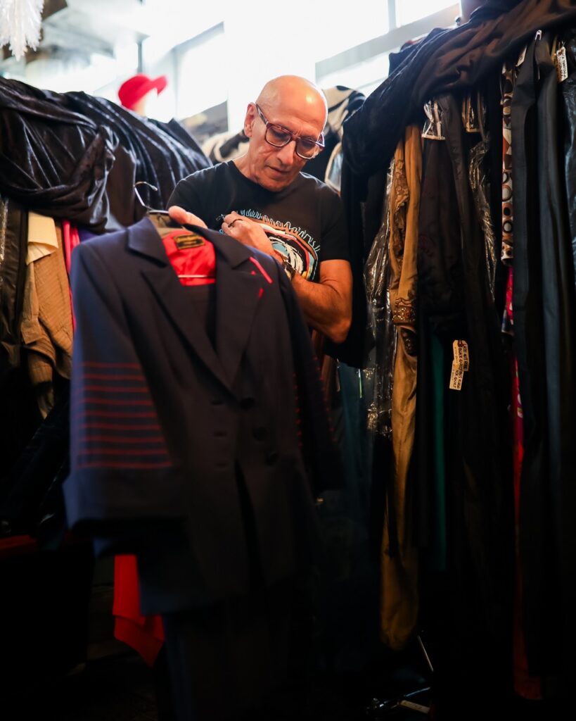 Richard Parsakian holds a vintage long suit jacket.