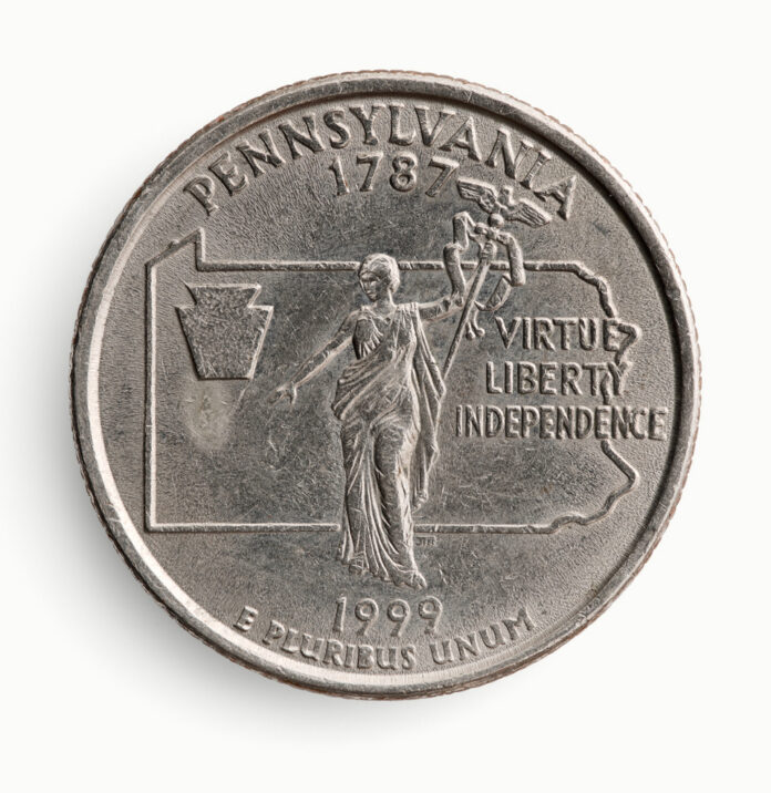 A 1999 Pennsylvania state quarter showing the reverse side with the Commonwealth's motto "Virtue, Liberty, Independence," a central female figure, and the state's geographical outline.