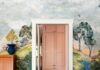 Blending Fantasy Into Interior Design with Michelle Gage A whimsical dining room featuring a Designers Guild forest landscape mural, two orange and white cats near the doorway to a blush pink kitchen, and a wooden piano.